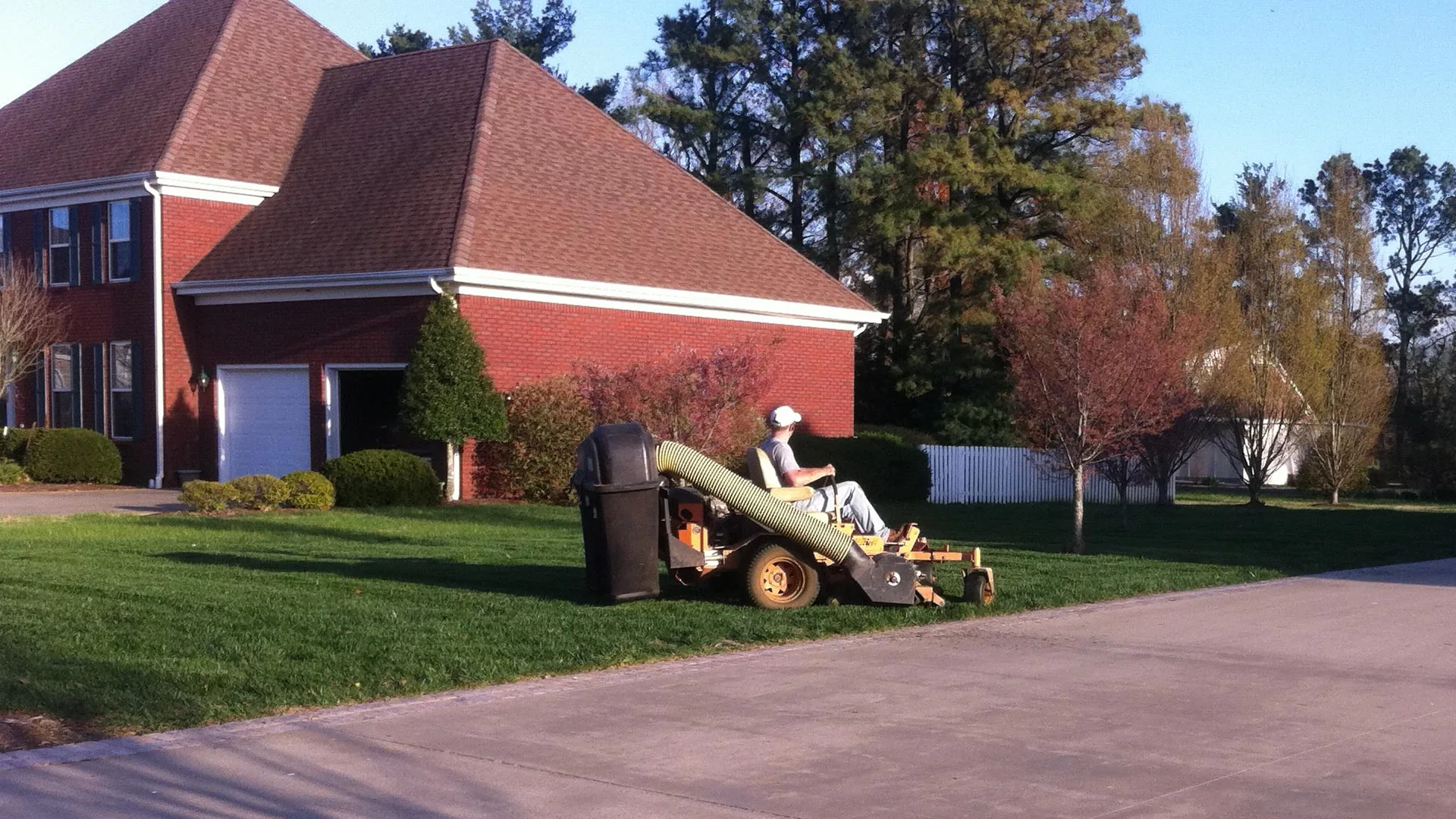 Well maintained lawn and landscaping at residential property.