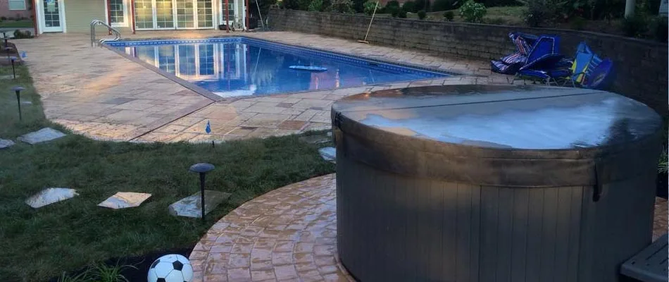 We have designed and built pavers around a pool and a stone paver pad for their hot tub  in Mayfield.
